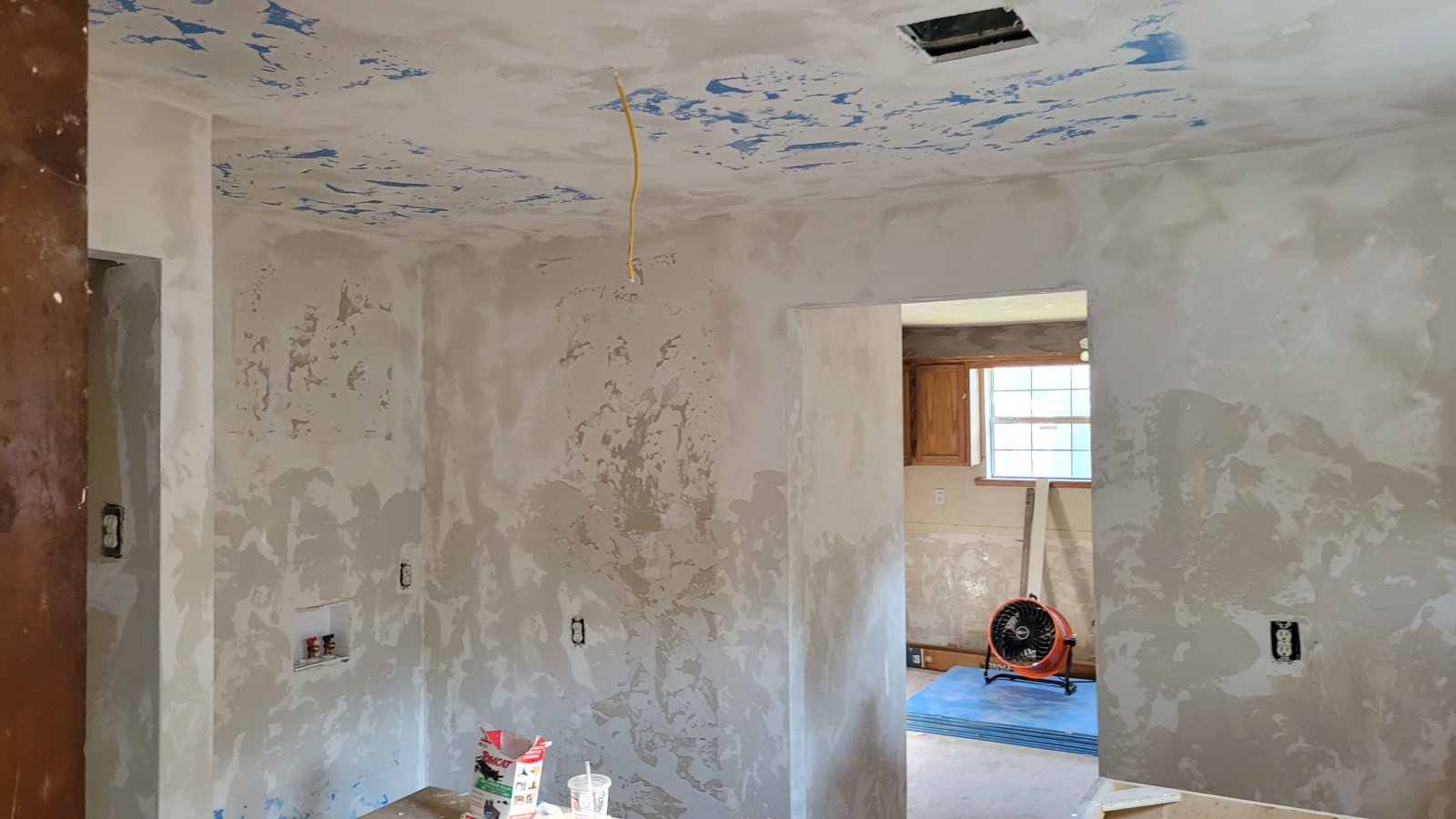 Close-up of drywall screws and fastening tools