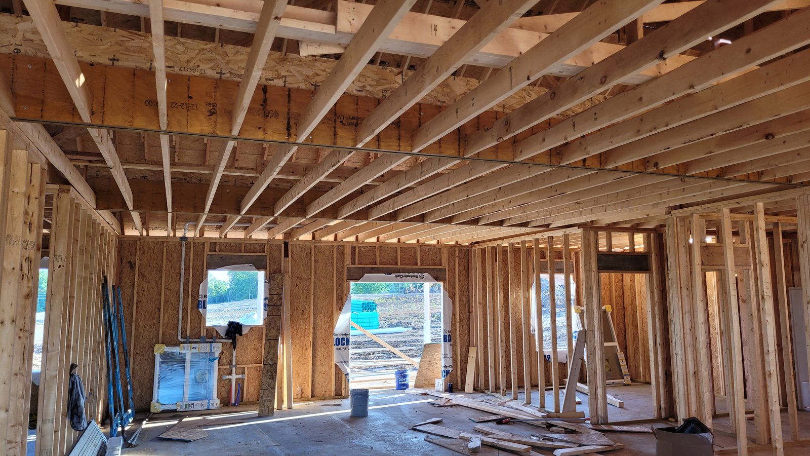 Interior construction with exposed framing and wiring
