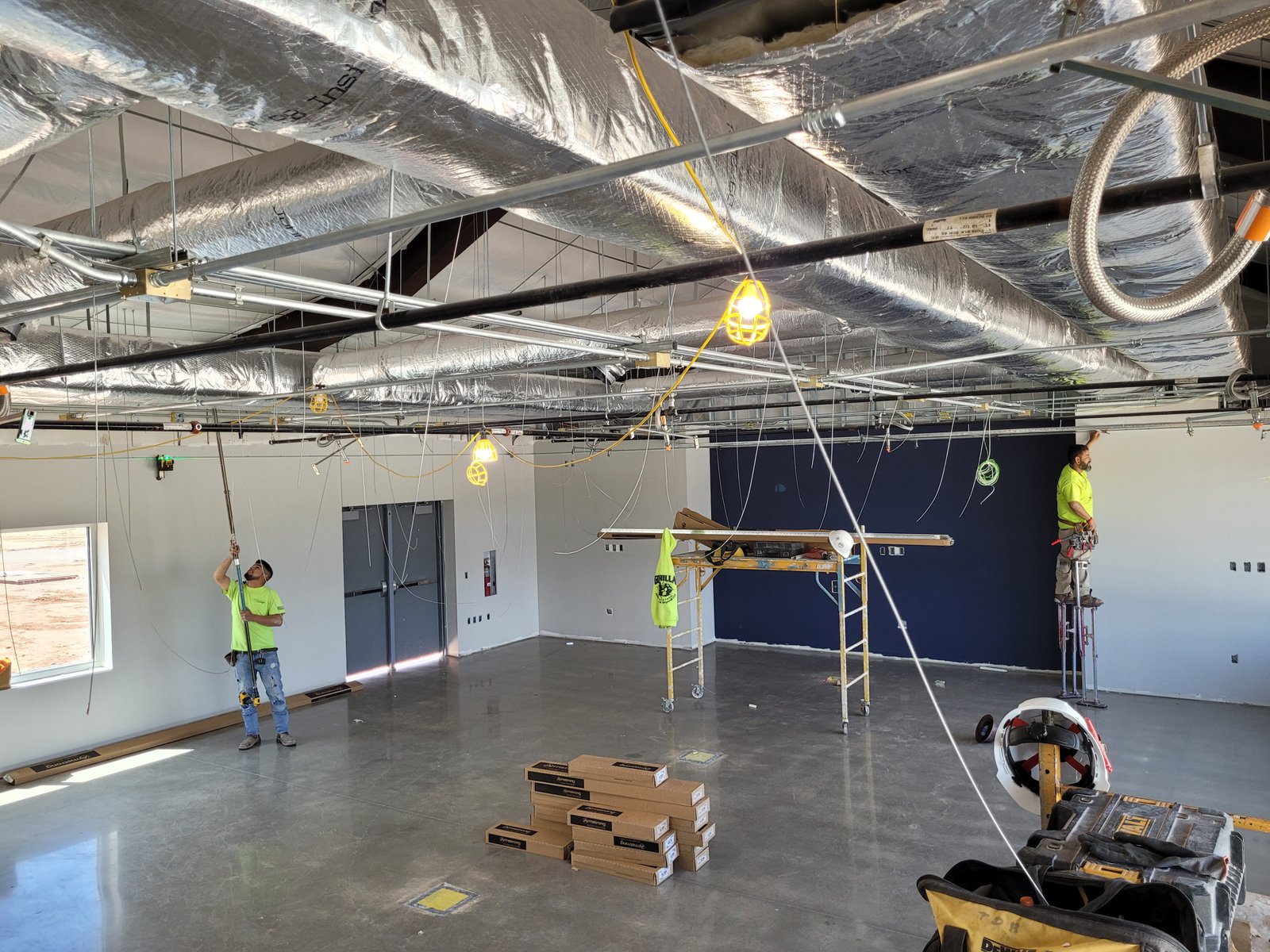 FRP panel installation on commercial kitchen walls with acoustic ceiling tiles